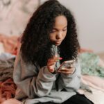 Teenage girl texting on her phone