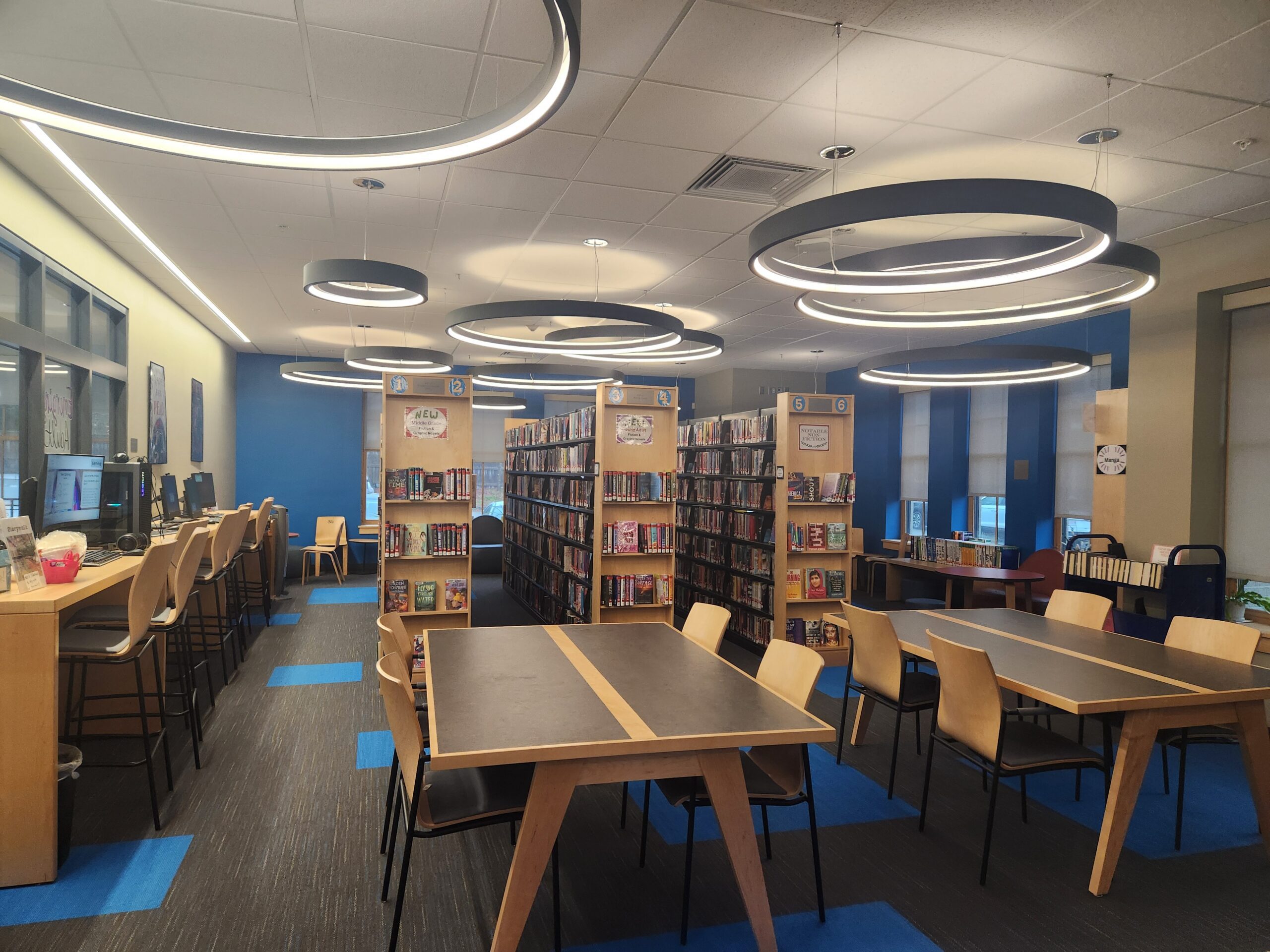 image showing the tables, shelves, and computers in the YA Room